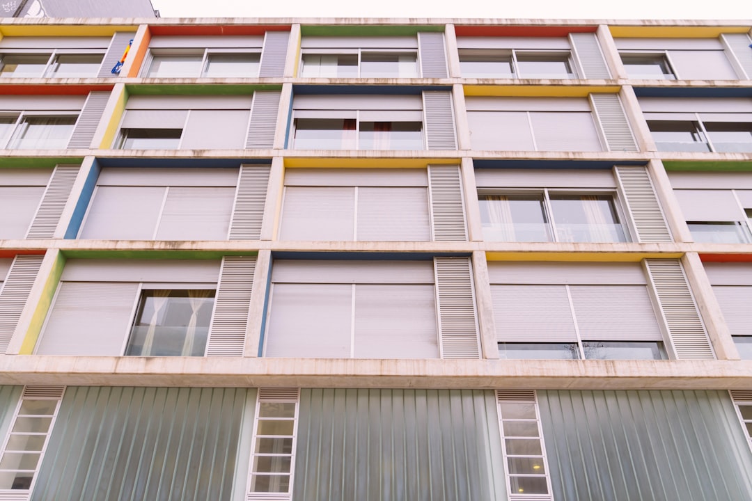 low-angle photo of gray concrete high-rise building