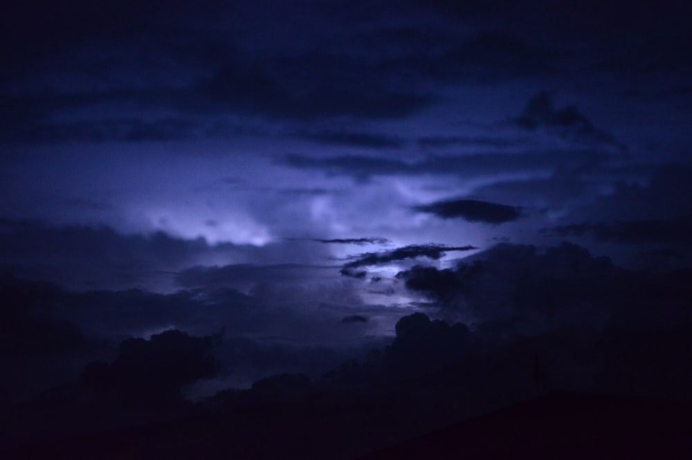 a dark sky filled with clouds and lightning