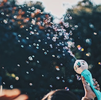 person's hand holding bubble toy