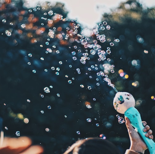 person's hand holding bubble toy