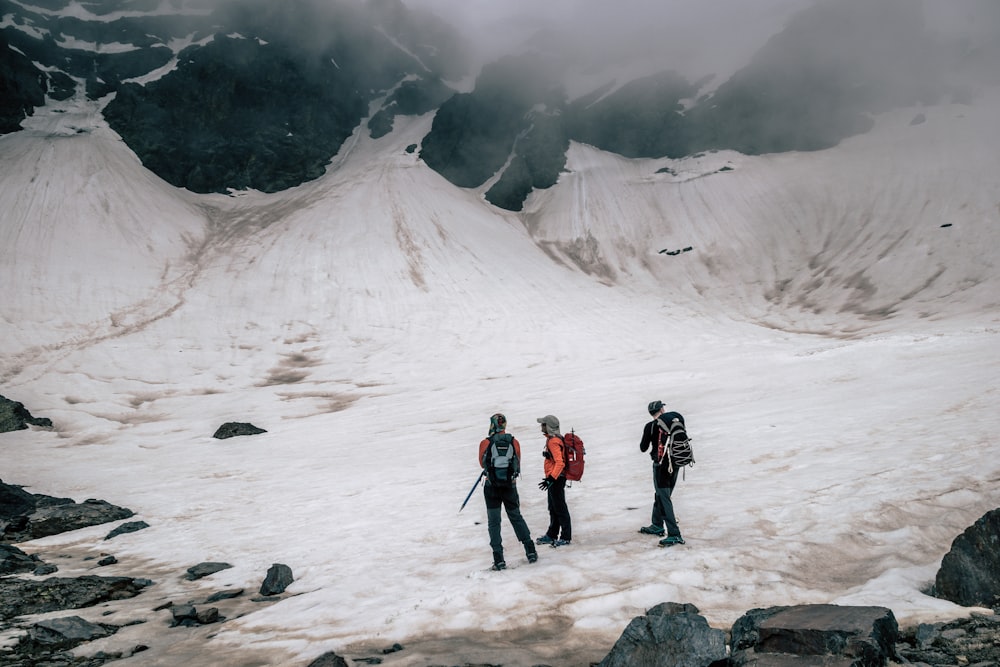 people on snow covered mountain