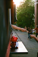 person reaching card beside trailer