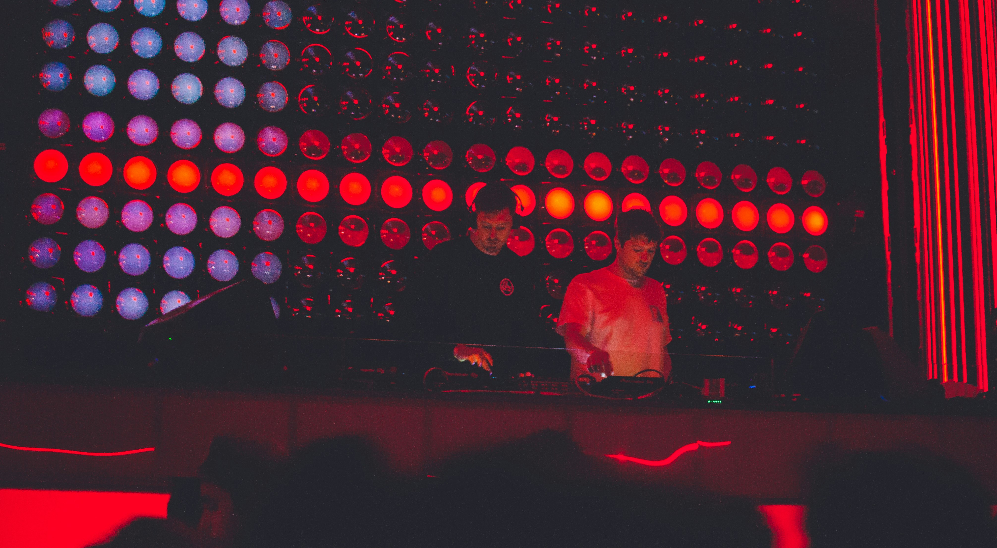 two DJ's performing on stage
