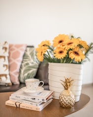 yellow flower on white ceramic vase