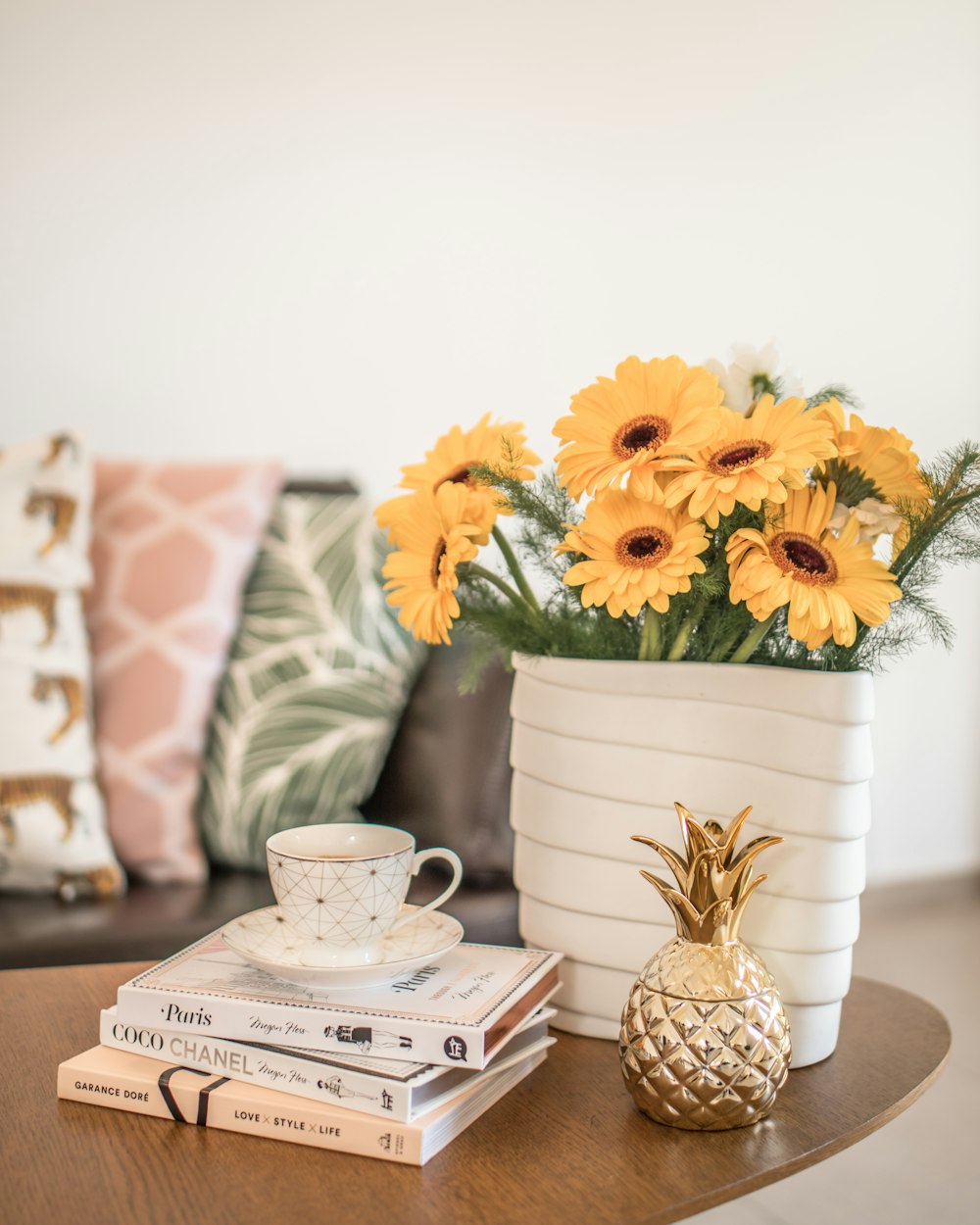 yellow flower on white ceramic vase