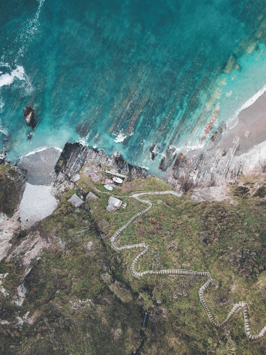 aerial photo of rock cliff stairway in Asturias Spain