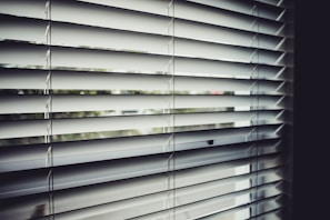close view of white window blinds