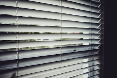 close view of white window blinds
