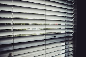 close view of white window blinds