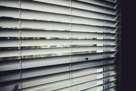 close view of white window blinds