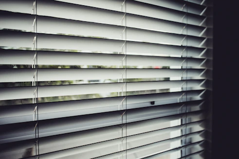 close view of white window blinds