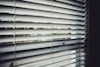 close view of white window blinds