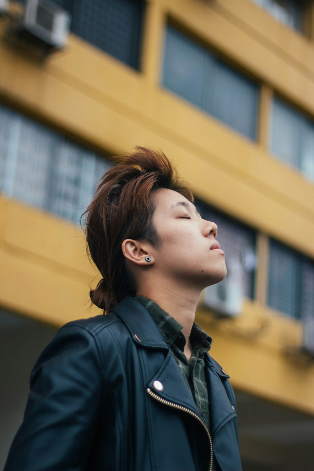 man wearing black notched lapel jacket