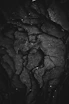 grayscale photography of rock formation