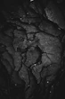 grayscale photography of rock formation