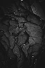 grayscale photography of rock formation