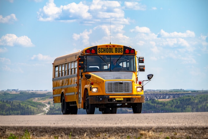 A school bus on a residential pathway, similar to the Clark County neighborhood routes where non-working gate codes kept CCSD drivers from reaching stops