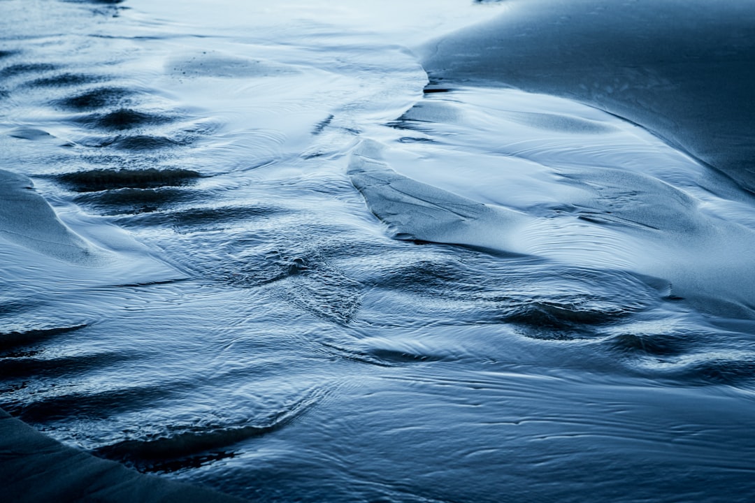 low-angle photography of flowing water