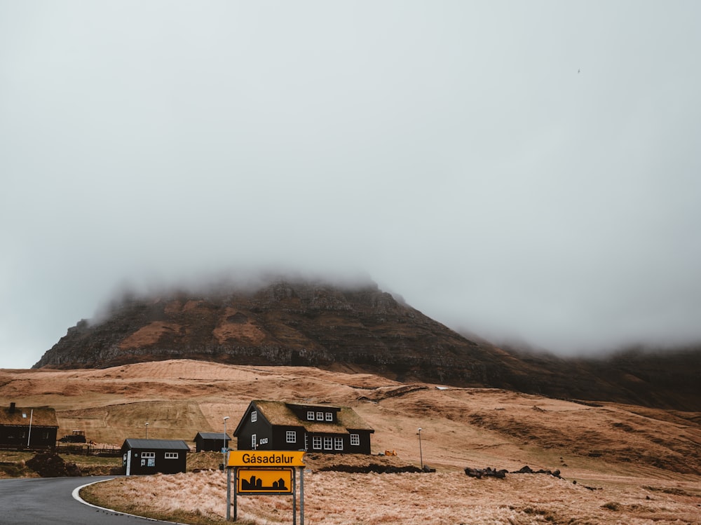 landscape photography of black house near mountain