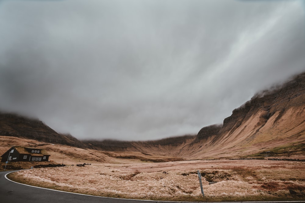 brown mountains under cloudy daytime