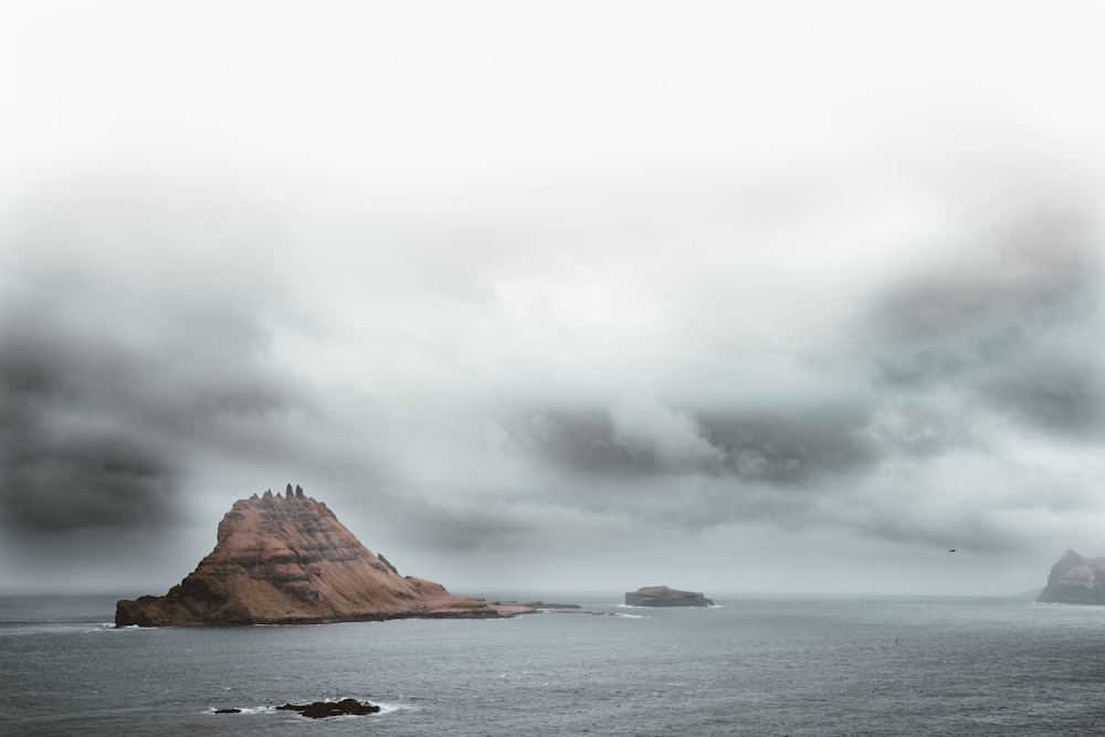 brown mountain in ocean