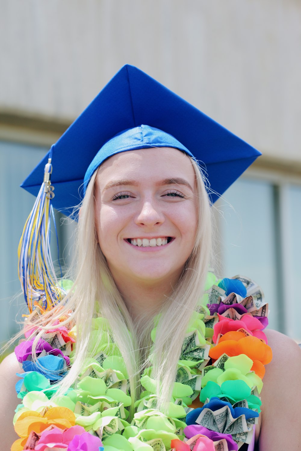 woman wearing blue mortar board