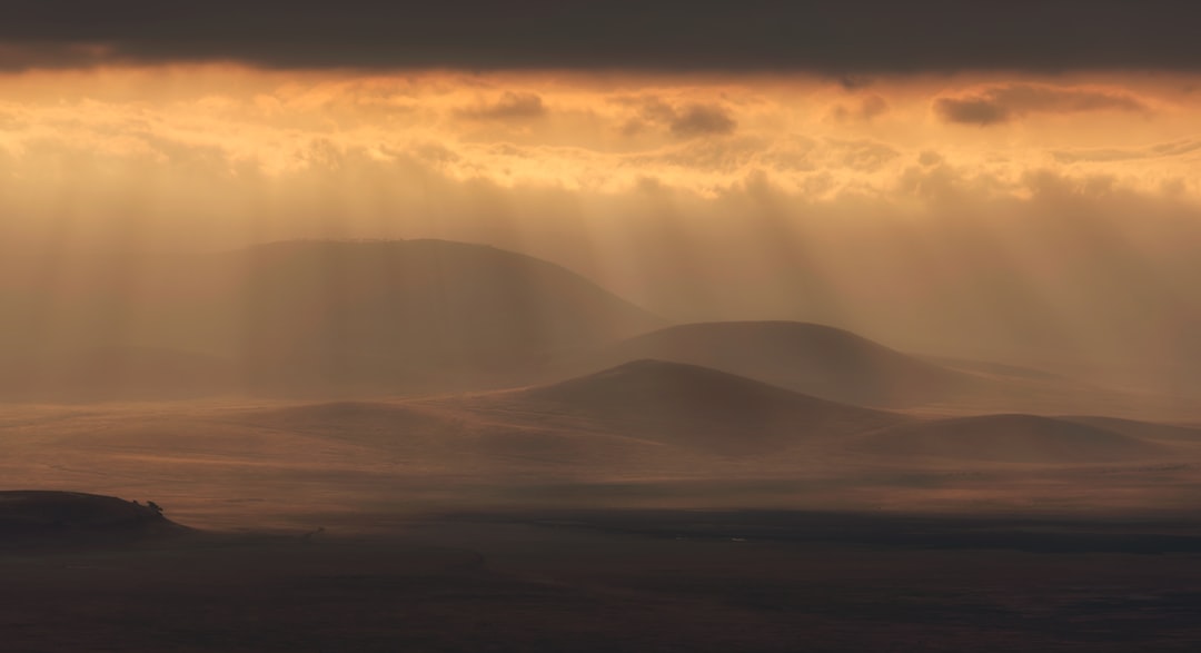 mountain under cloudy sky, Amazing sunrise at Ngorongoro Crater
