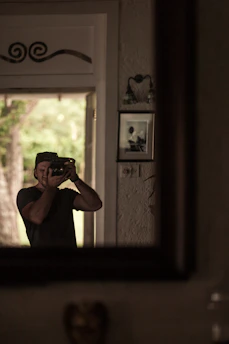 A professional photographer capturing a business event with natural light.