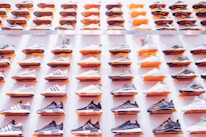 Close-up of stylish skate shoes arranged neatly on shelves.
