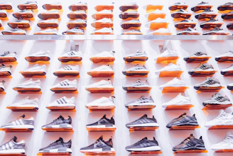 Close-up of stylish sneakers arranged neatly on a minimalist shelf