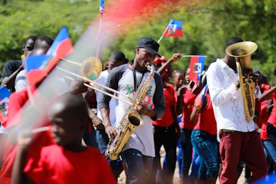 man playing wind instrument flag day google meet background