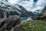 body of water surrounded by mountains during daytime