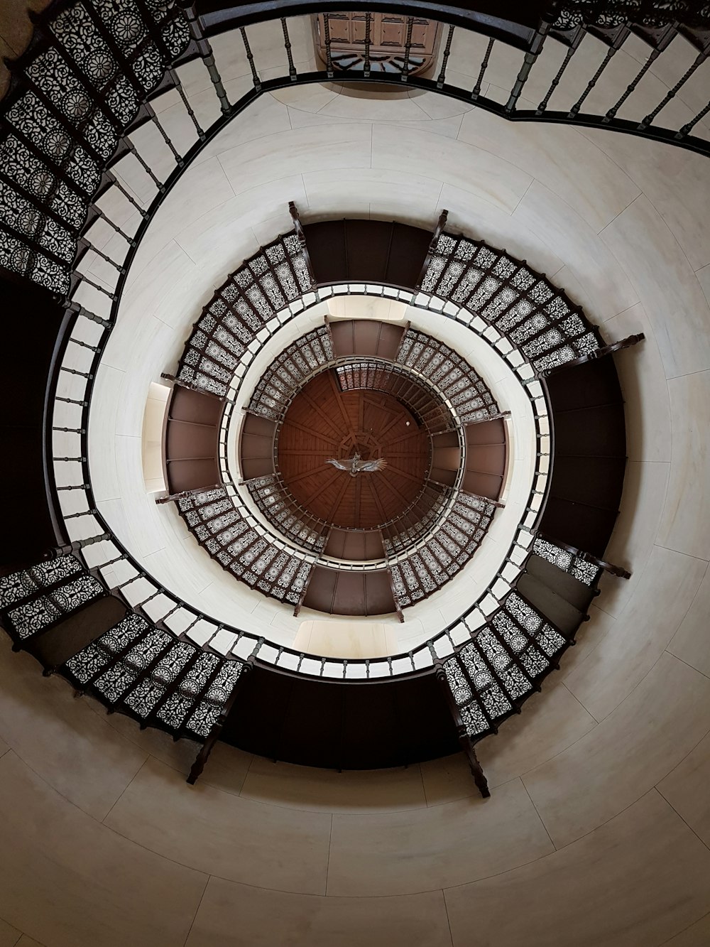 worm's-eye view photography of spiral stairs
