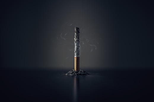 single cigarette stick with ashes stick