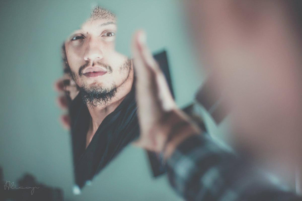 Patient looking at hair growth in mirror