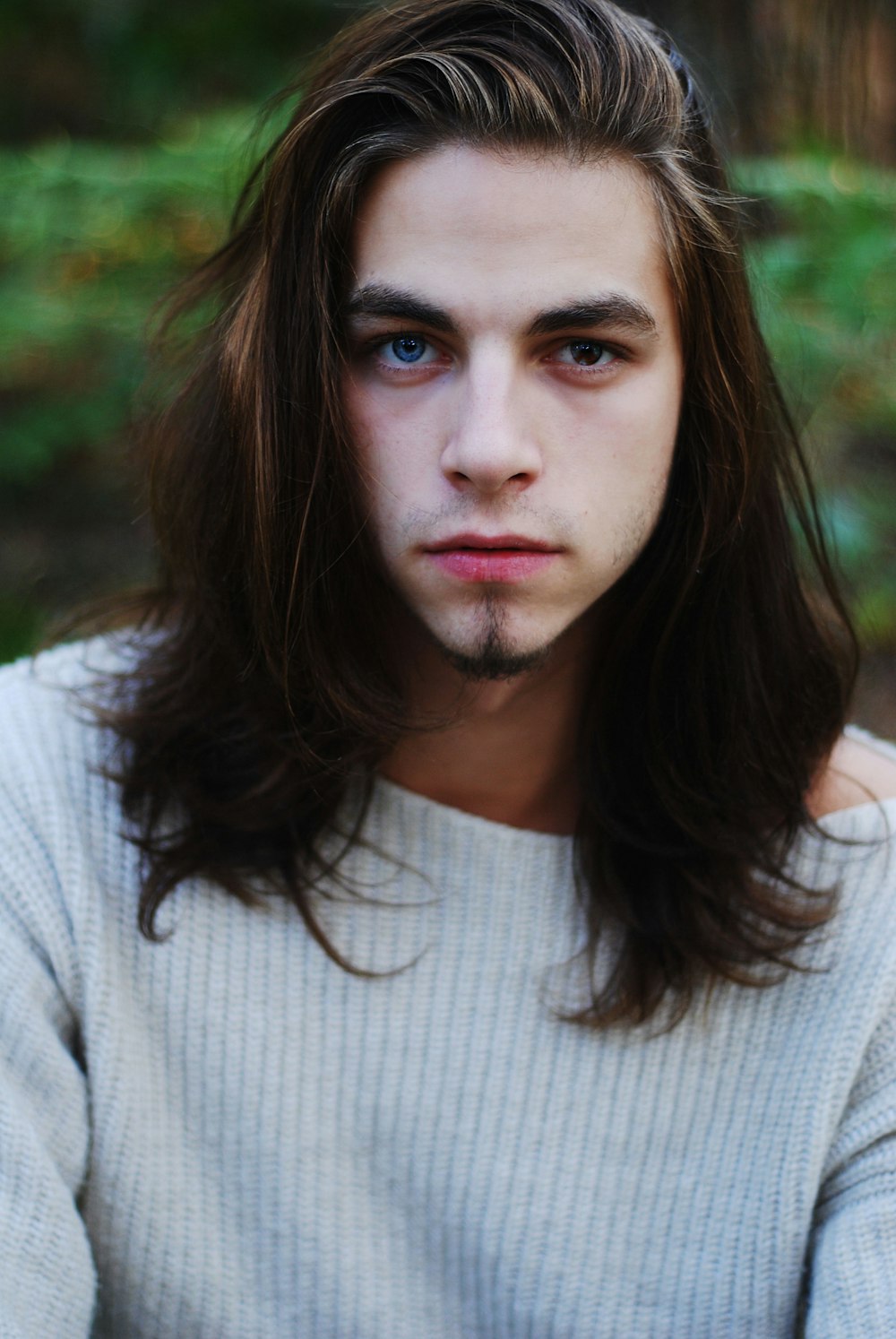 portrait photography of man in gray sweater