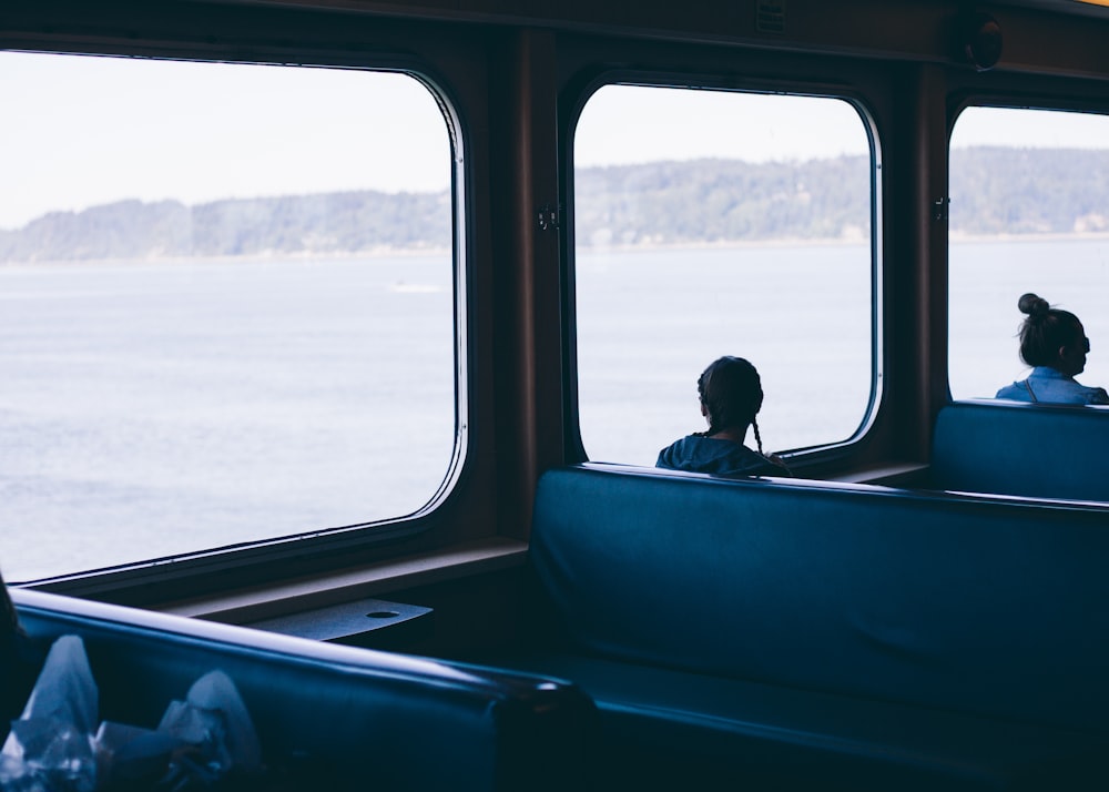 person inside boat overlooking window view