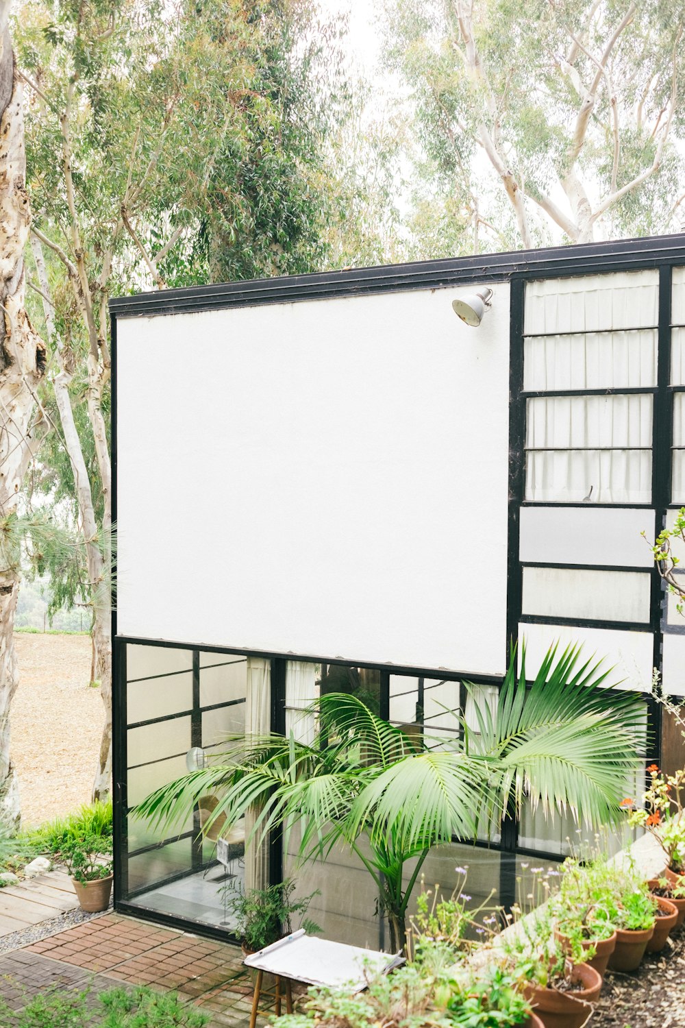 white and black house near trees at daytime