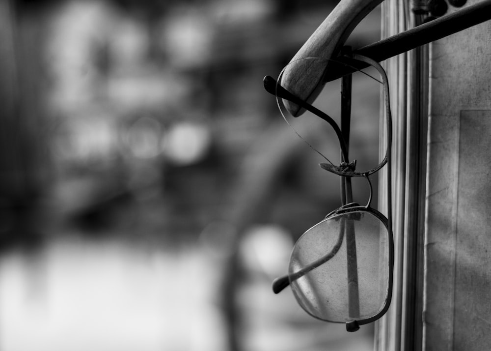 grayscale photo of eyeglasses