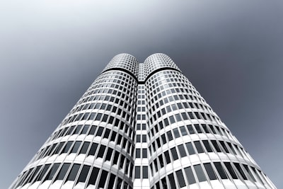 low-angle photography of curtain wall tower building