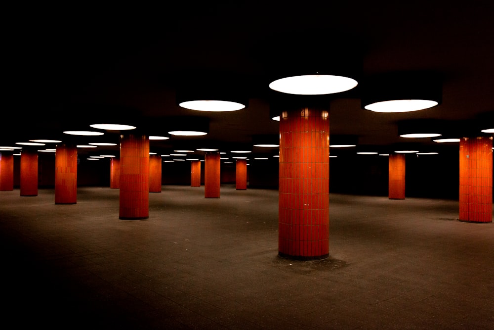 red post under ceiling light at night