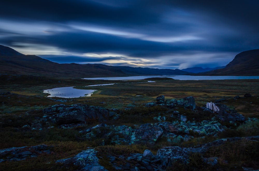 landscape photo of ruins near body of water