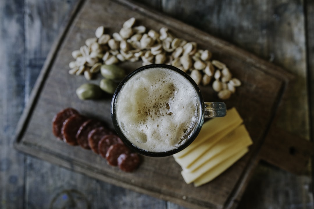 sliced cheese beside nuts, Sometimes simple things are the best things… enjoy a beer with friends.