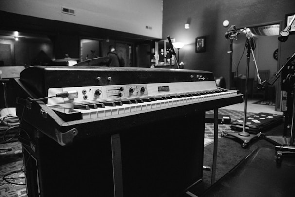 A vibrant image of vintage synthesizers in a recording studio.