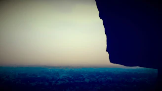 A time-lapse photo showing a rock formation subtly changing shape at dusk.