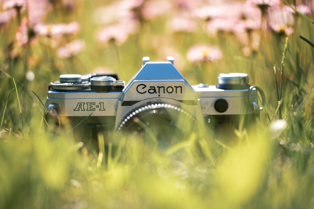 silver Canon AE-1 SLR camera