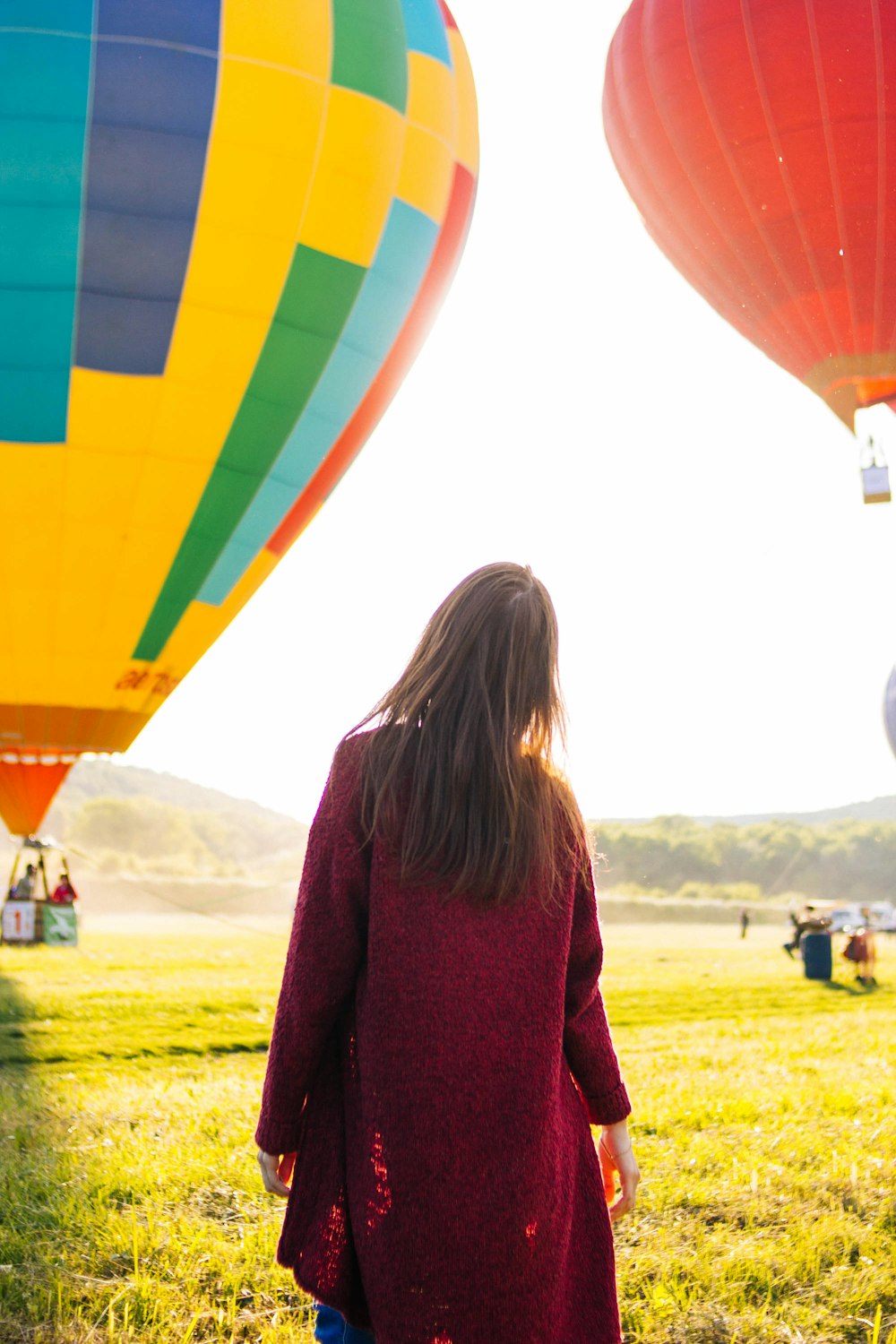 woman standing near hot air balloon