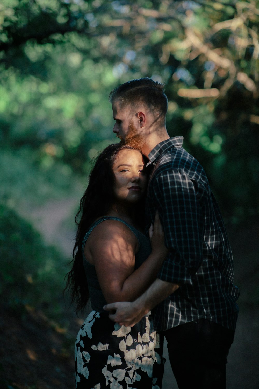 woman in black and white dress touching man's chest