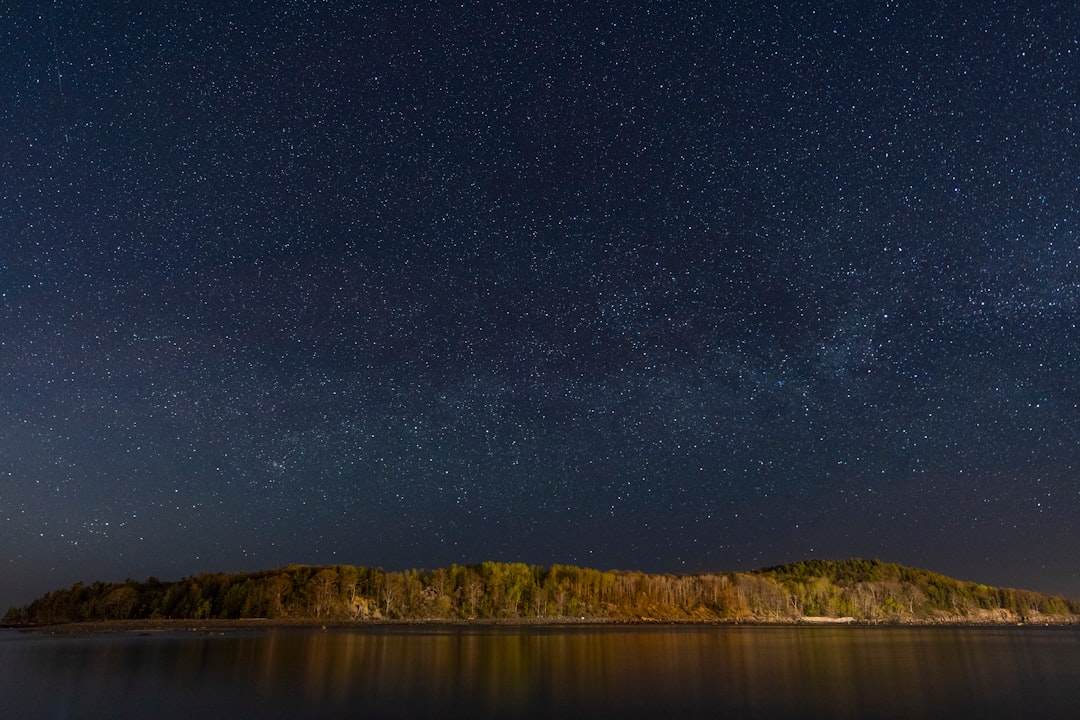 calm body of water during night