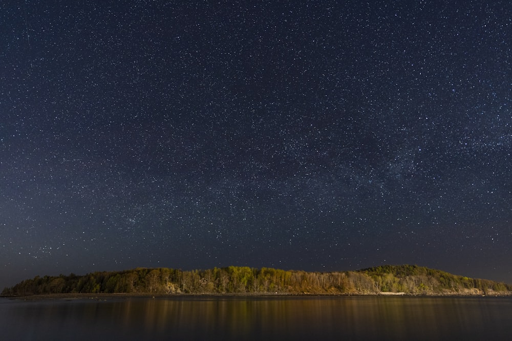 calm body of water during night